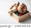 Wooden World Globe Placed Inside Elegant Gift Box with Ribbon for Global Travel or Education Theme 134016534