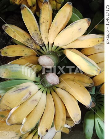 Vibrant Banana Bunch Displayed In A Crowded Market, Fresh Yellow Fruit For Healthy Snack Vibrant Banana Bunch Displayed In A Crowded Market, Fresh Yellow Fruit For Healthy Snack 134017175