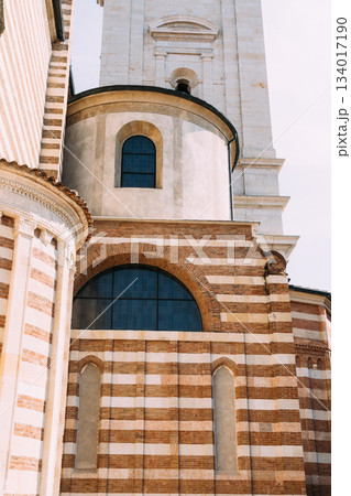 Architectural detail of the Verona Cathedral, showcasing its unique brickwork and design. 134017190
