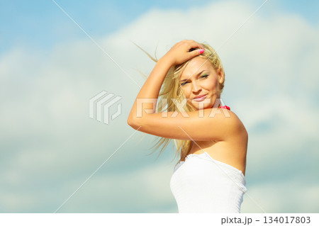 Beauty blonde woman portrait on sky background. 134017803