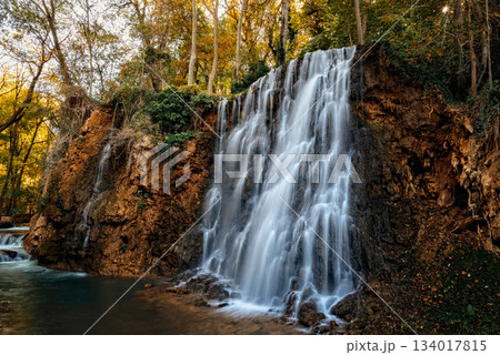 Scenic waterfall cascading down rocks in Monasterio de Piedra, Spain 134017815