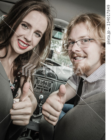 Happy man and woman in car 134017849