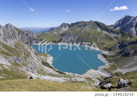 Lunersee artificial lake in Ratikon Alps shows stunning water color and mountain landscape in Vorarlberg Austria Lunersee artificial lake in Ratikon Alps shows stunning water color and mountain landscape in Vorarlberg Austria 134018239