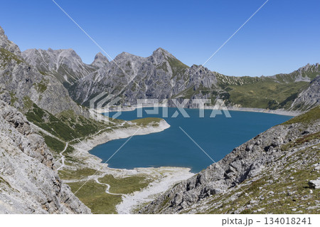 Lunersee in Ratikon Alps offers beautiful views of the blue water and rocky mountains in Vorarlberg, Austria during the clear weather 134018241