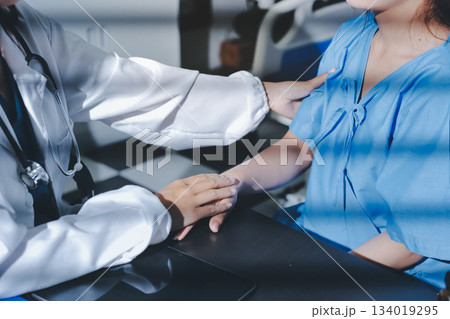 Male doctors shake hands with patients encouraging each other and praying for blessings. To offer love, concern, and encouragement while checking the patient's health. concept of medicine 134019295