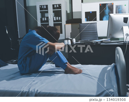 A patient with depression looks outside. A patient with depression looks outside. 134019308