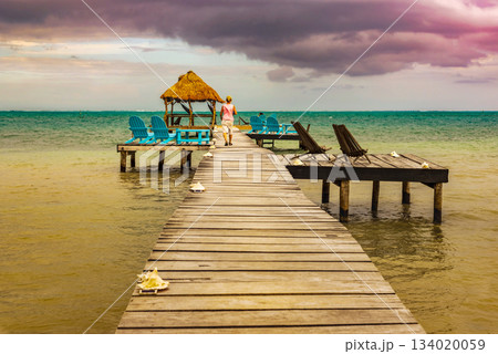 Wooden pier and Caribbean Sea view at Caye Caulker Belize Caribbean. 134020059