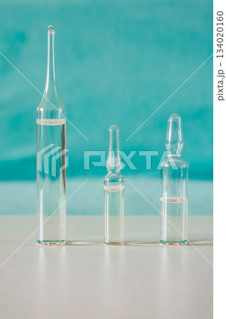 glass ampoules with medicine on table, selective focus glass ampoules with medicine on table, selective focus 134020160