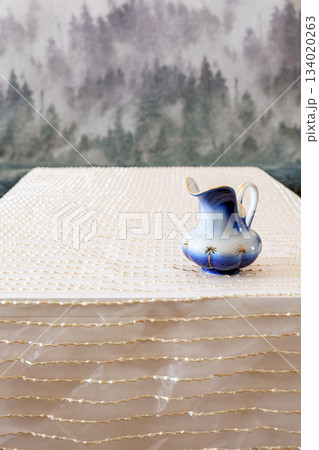 blue ceramic jug on table blue ceramic jug on table 134020263