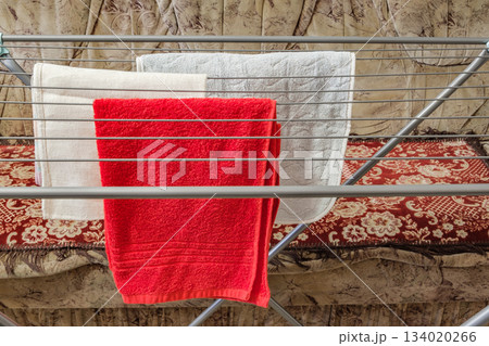 towels are drying on the dryer 134020266
