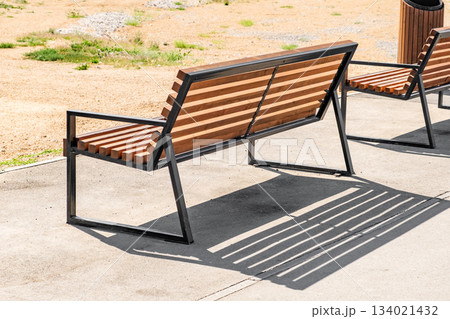 outdoor bench with wooden crossbars 134021432