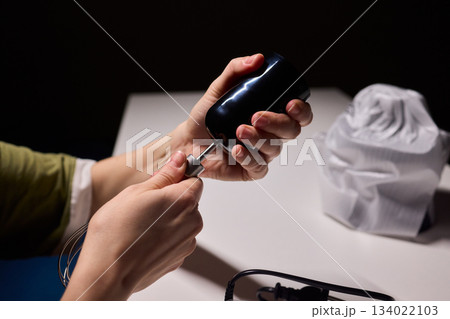 Preparing blender on kitchen counter, Scene shows detailed process of assembling immersion blender, Cozy kitchen scene of hands carefully putting together blending device 134022103