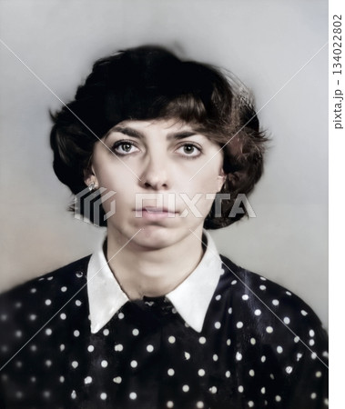 Vintage portrait of a serious young beautiful woman. Retro photo from 1990. Vintage portrait of a serious young beautiful woman. Retro photo from 1990. 134022802