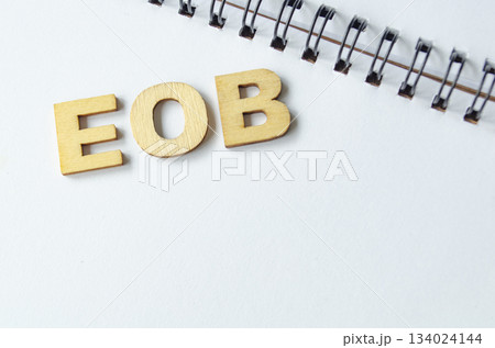 End Of Business in short form on a white notepad. End Of Business in short form on a white notepad. 134024144