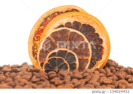 Detailed shot of dried citrus slices with vibrant hues, surrounded by aromatic coffee beans Detailed shot of dried citrus slices with vibrant hues, surrounded by aromatic coffee beans 134024452