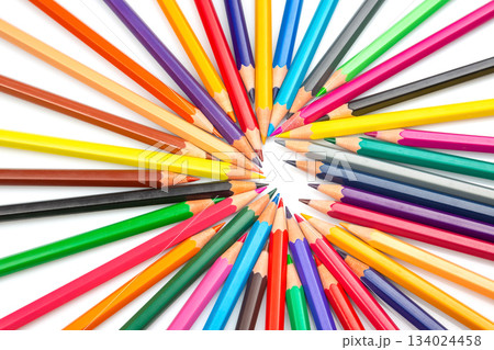Colorful pencils in a circular burst pattern against a white background 134024458