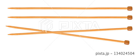 wooden knitting needles, lie crossed. Isolated on white background 134024504