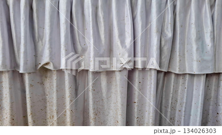 Layered White Fabric Ruffles and Dirty Curtain Close-Up Texture 134026303