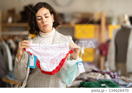 Adult woman chooses underwear and panties Adult woman chooses underwear and panties 134026470
