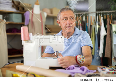 Mature male tailor resting 134026533