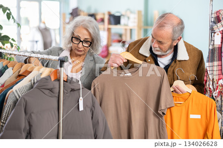 elderly couple chooses T shirts for every day 134026628