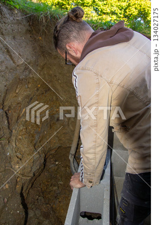 Building a fundamental brick wall in a mountain. Building a fundamental brick wall in a mountain. 134027175
