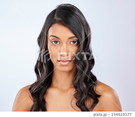Face, hair care or woman in studio portrait for healthy natural shine, beauty or wellness on white background. Glowing female model, Indian girl or salon spa curly styling cosmetics in grooming Face, hair care or woman in studio portrait for healthy natural shine, beauty or wellness on white background. Glowing female model, Indian girl or salon spa curly styling cosmetics in grooming 134028377