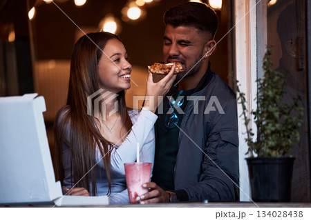 Pizza, restaurant and happy couple feeding fast food on playful romantic date for Valentines Day, bonding and quality time together. Hungry, love and fun eating girlfriend and boyfriend at shop store Pizza, restaurant and happy couple feeding fast food on playful romantic date for Valentines Day, bonding and quality time together. Hungry, love and fun eating girlfriend and boyfriend at shop store 134028438