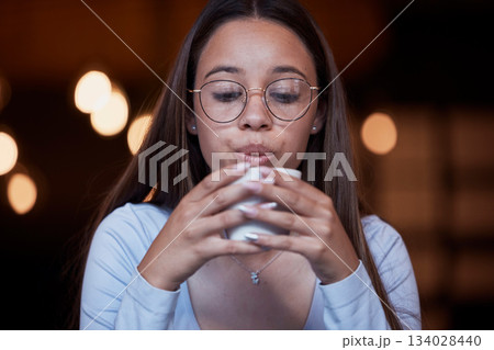 Cafe, coffee and woman blow on warm tea cup, hot chocolate or espresso drink in retail shop, store or restaurant. Commerce service, relax and young thirsty person blowing cool air on latte beverage 134028440