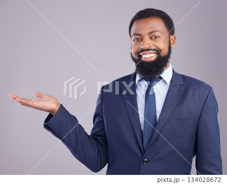 Portrait, black man and product placement for business in studio isolated on a gray background. Marketing, mockup and smile of happy African professional with branding, advertising or mock up space. Portrait, black man and product placement for business in studio isolated on a gray background. Marketing, mockup and smile of happy African professional with branding, advertising or mock up space. 134028672