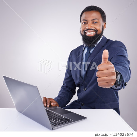 Black man, laptop and thumbs up isolated on a white background portrait for winning, online success and thank you. Happy business person or winner with yes, like and vote sign on computer in studio Black man, laptop and thumbs up isolated on a white background portrait for winning, online success and thank you. Happy business person or winner with yes, like and vote sign on computer in studio 134028674