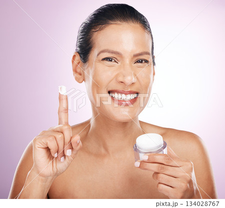 Face, cream jar and skincare of woman in studio isolated on purple background. Mature portrait, cosmetics and happy female model with dermatology lotion, creme or moisturizer product for anti aging. Face, cream jar and skincare of woman in studio isolated on purple background. Mature portrait, cosmetics and happy female model with dermatology lotion, creme or moisturizer product for anti aging. 134028767