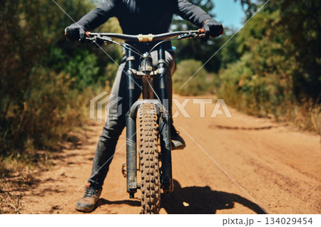 Mountain bike, person on path and fitness outdoor, ready for cycling and extreme sports with biking and exercise. Workout, riding in nature with bicycle and athlete, training for race with cyclist 134029454