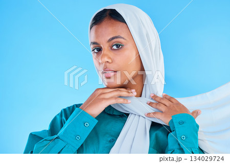 Woman, muslim and portrait of hijab in studio, blue background or color backdrop. Young female model, islamic culture or scarf for peace, religion and arabic fashion of eid mubarak, beauty or ramadan Woman, muslim and portrait of hijab in studio, blue background or color backdrop. Young female model, islamic culture or scarf for peace, religion and arabic fashion of eid mubarak, beauty or ramadan 134029724