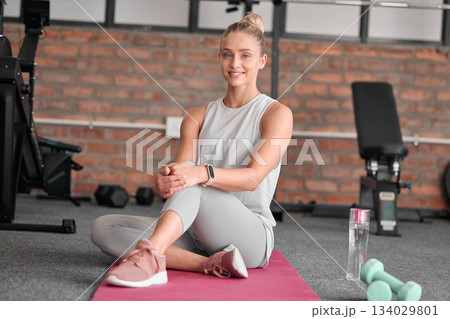 Portrait, stretching knee and woman in gym ready to start workout, flexibility training or exercise. Sports, fitness and happy female athlete stretch, warm up or prepare for exercising on yoga mat. 134029801