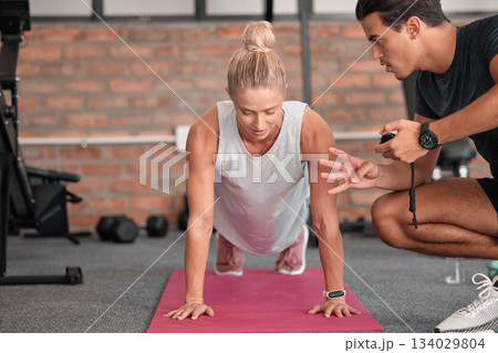 Fitness, push up and woman with personal trainer, partner or gym coach for support, performance check and muscle goals. Athlete or sports people in strong workout, exercise coaching or training timer Fitness, push up and woman with personal trainer, partner or gym coach for support, performance check and muscle goals. Athlete or sports people in strong workout, exercise coaching or training timer 134029804