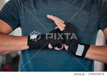 Man, hands and boxing and fitness with martial arts in gym, exercise and power with strong person. Workout, male boxer training in combat and sports, athlete ready to fight and closeup of mma fighter 134029818