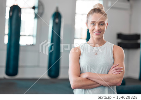 Portrait, gym and smile of woman with arms crossed ready to start workout, training or exercise. Sports, fitness and happy, proud and confident female athlete from Canada preparing for exercising. Portrait, gym and smile of woman with arms crossed ready to start workout, training or exercise. Sports, fitness and happy, proud and confident female athlete from Canada preparing for exercising. 134029828