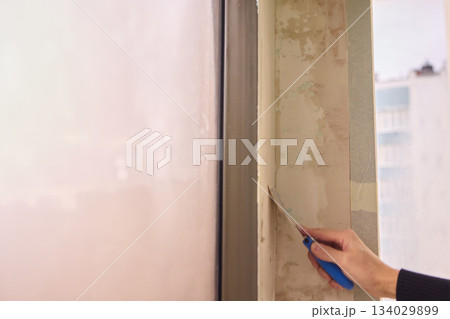 The Wall Repair Process Involves Properly Using Spackling Paste for a Quality Finish 134029899