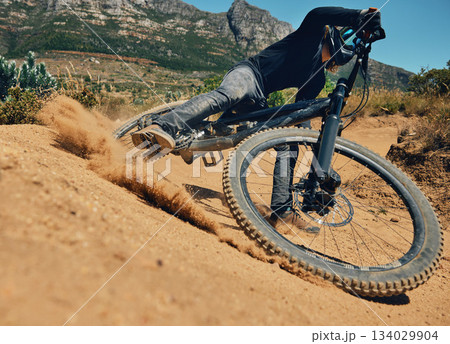 Cycling, action and extreme sports with man on mountain bike for adventure, fitness and adrenaline junkie. Exercise, risk and fast with male athlete in nature for workout, training and speed 134029904