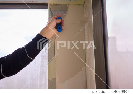 The Wall Repair Process Involves Properly Using Spackling Paste for a Quality Finish 134029905