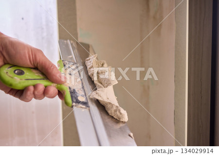 The Wall Repair Process Involves Properly Using Spackling Paste for a Quality Finish 134029914