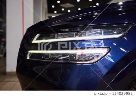 Close up of a cars headlight, part of automotive design 134029985