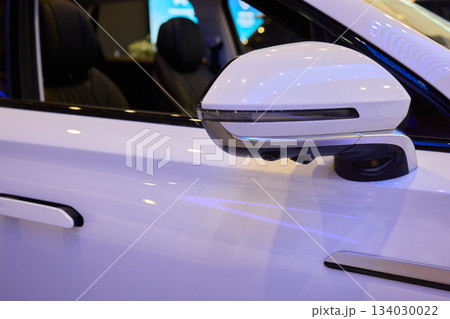 Detailed automotive reflection, Closeup of mirror and finish, Focus on car mirror with smooth surface, Close shot highlighting vehicle mirror and polished details Detailed automotive reflection, Closeup of mirror and finish, Focus on car mirror with smooth surface, Close shot highlighting vehicle mirror and polished details 134030022