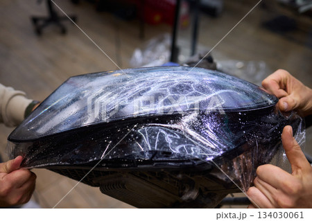 Applying a Protective Film on the Surface of Your Car for Enhanced Durability and Shine Applying a Protective Film on the Surface of Your Car for Enhanced Durability and Shine 134030061