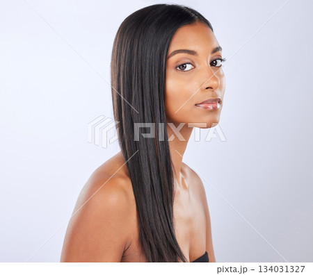 Indian woman, hair care or beauty in studio portrait for strong, healthy natural shine or wellness. Face of glowing young girl model, self love or salon cosmetics in grooming on white background Indian woman, hair care or beauty in studio portrait for strong, healthy natural shine or wellness. Face of glowing young girl model, self love or salon cosmetics in grooming on white background 134031327