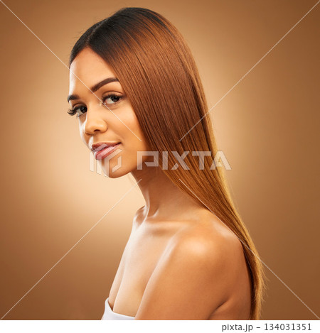 Brown hair, beauty and portrait of woman in studio for growth and color shine or healthy texture. Aesthetic female model for haircare, natural makeup and hairdresser or salon on gradient background Brown hair, beauty and portrait of woman in studio for growth and color shine or healthy texture. Aesthetic female model for haircare, natural makeup and hairdresser or salon on gradient background 134031351