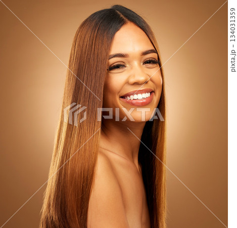 Hair care, beauty and smile of woman portrait in studio for growth and color shine or healthy texture. Aesthetic female happy for haircare, natural makeup and hairdresser or salon brown background Hair care, beauty and smile of woman portrait in studio for growth and color shine or healthy texture. Aesthetic female happy for haircare, natural makeup and hairdresser or salon brown background 134031359