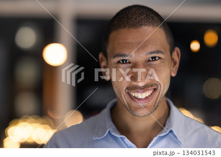 Business man portrait, smile and corporate worker ready for financial and accounting work at night. Company vision and happiness of a black man smile about finance growth in a modern office 134031543