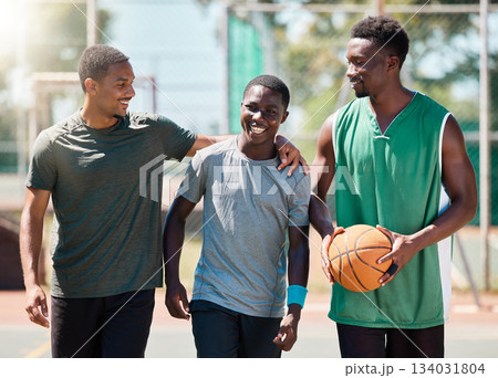 Basketball player, happy friends and walking together in conversation, training or exercise in summer. Team happiness, basketball court and basketball for black man group, outdoor or game in sunshine 134031804